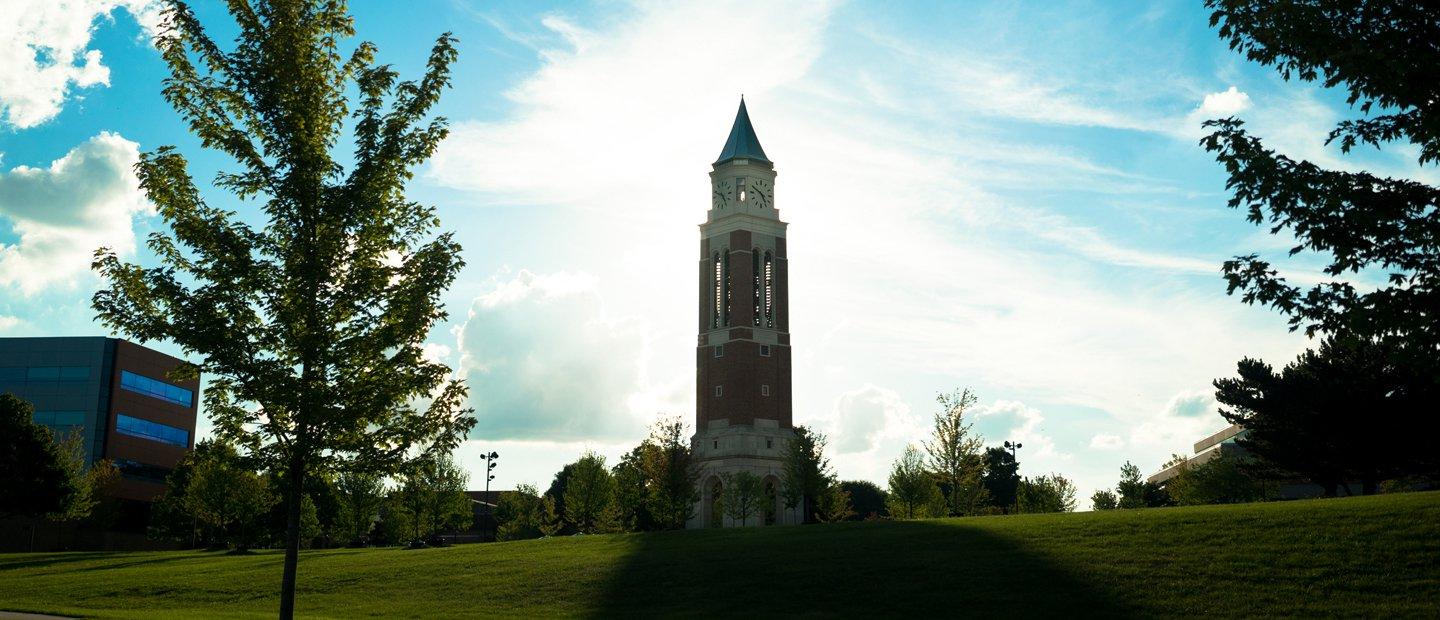 Elliott Tower with the sun shining behind it